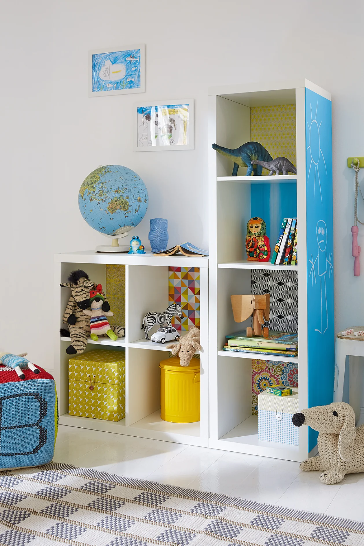 Here's an idea that kids will love. Each shelf has its own background, using decorative paper, stuck with tesa® Spray Glue PERMANENT, and on the side of the unit, there's a big blackboard so they're free to write or paint.