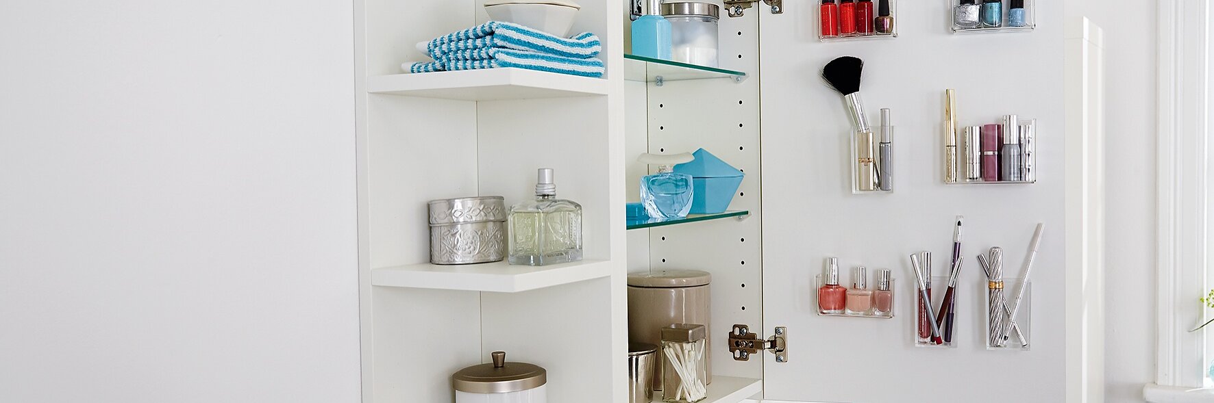 Are your lipstick, nail polish and other cosmetics getting lost on your shelves? If so, keep them in clear acrylic glass containers, attached almost invisibly to the inside of your glass or mirrored cupboard door, using tesa Powerbond® TRANSPARENT.
