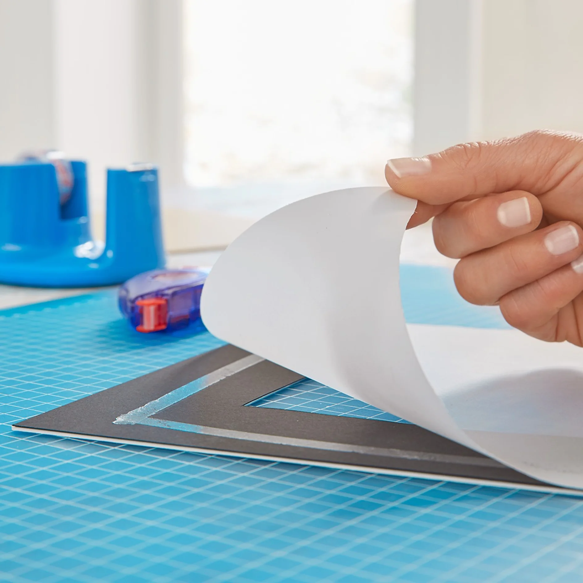 Using an adhesive roller to make a picture frame wall light.