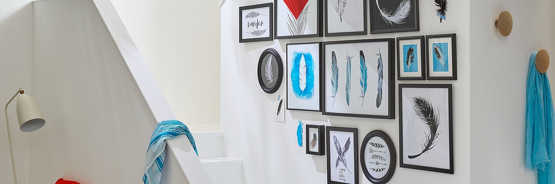 A group of pieces of art in frames of various sizes is a great idea for a transitional space like a staircase.