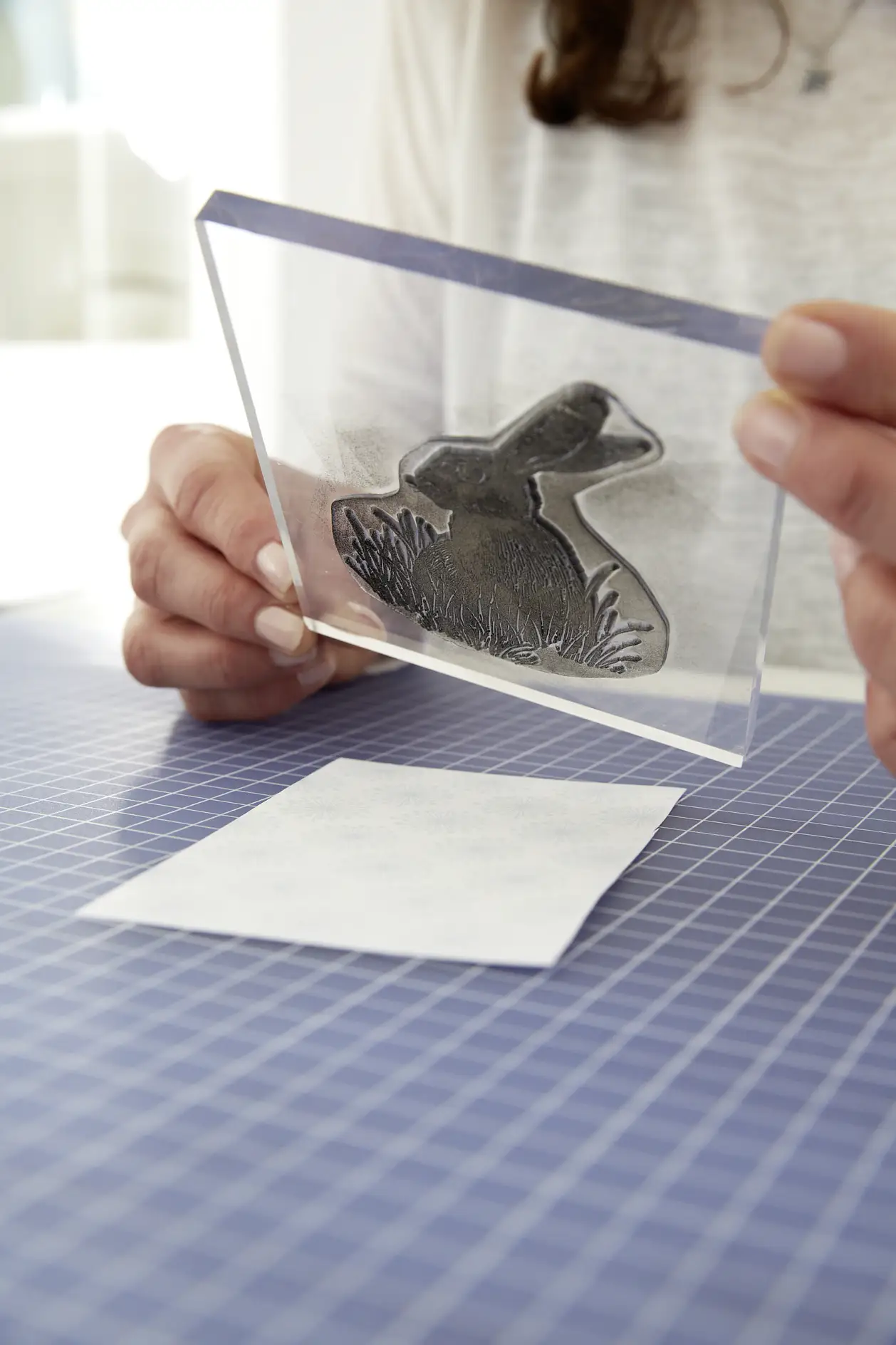 Cut out a 9 x 13 cm piece of the patterned paper and stamp on the bunny motif.