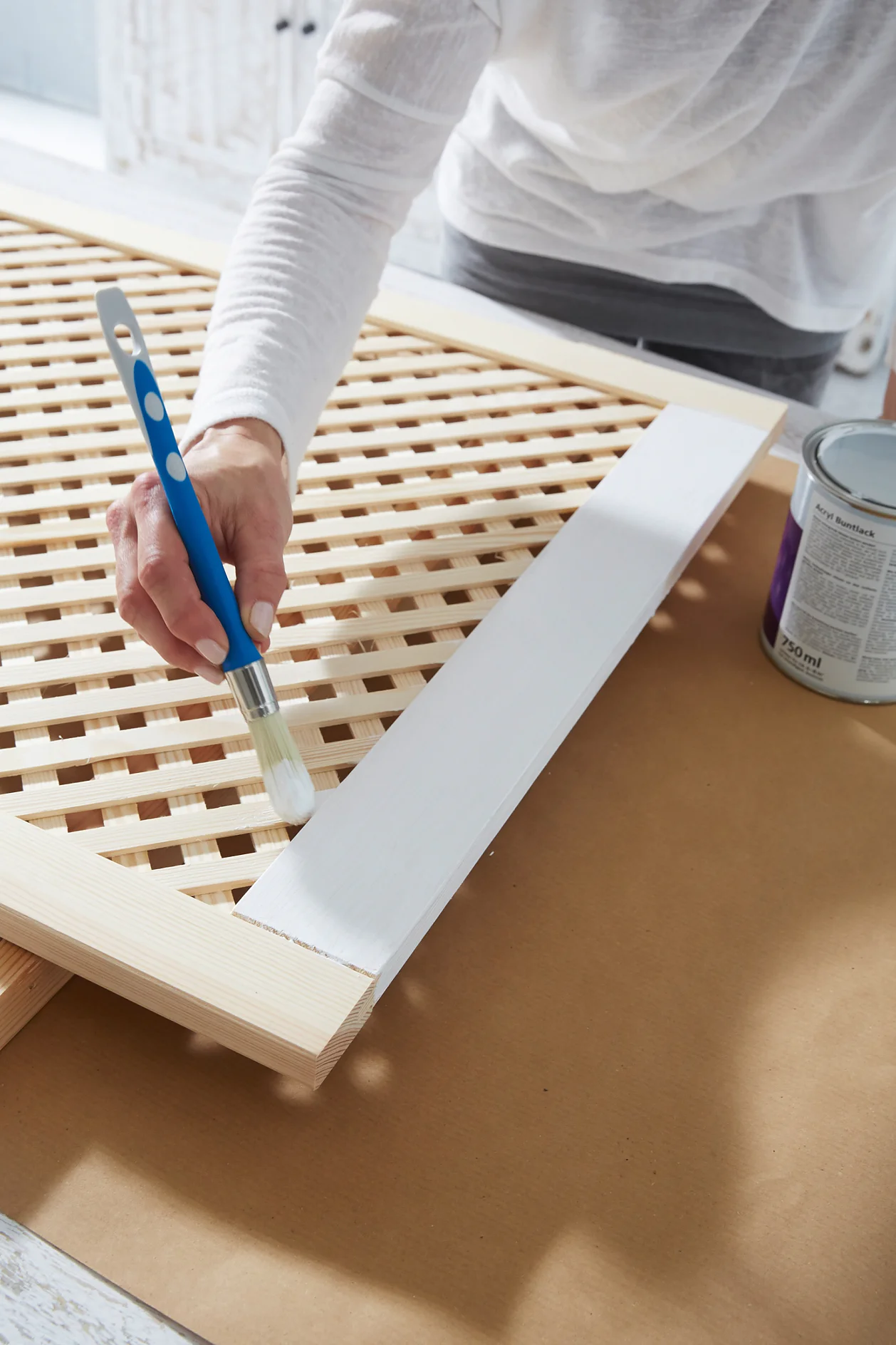 Paint the screen door with the undercoat, then varnish on both sides.