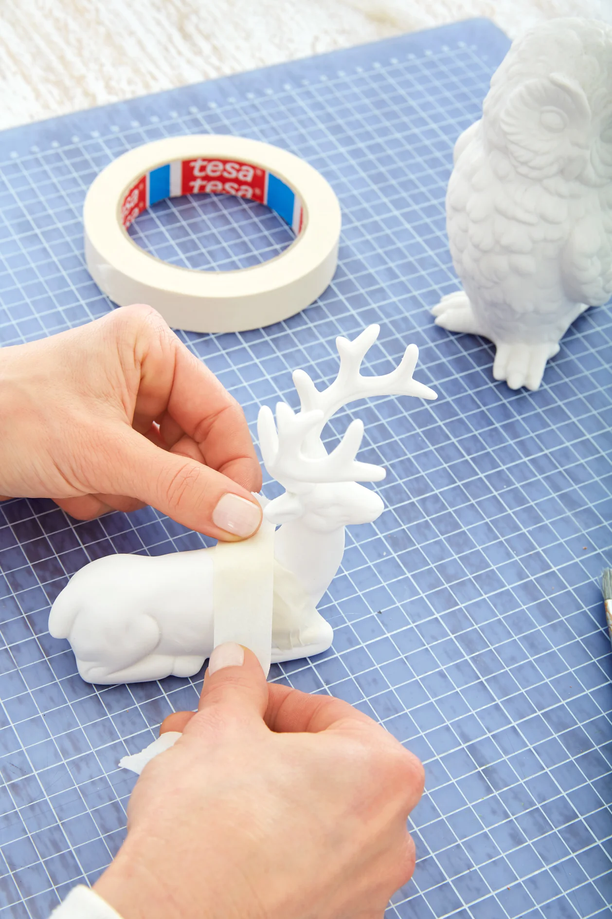 Masking the porcelain animal.