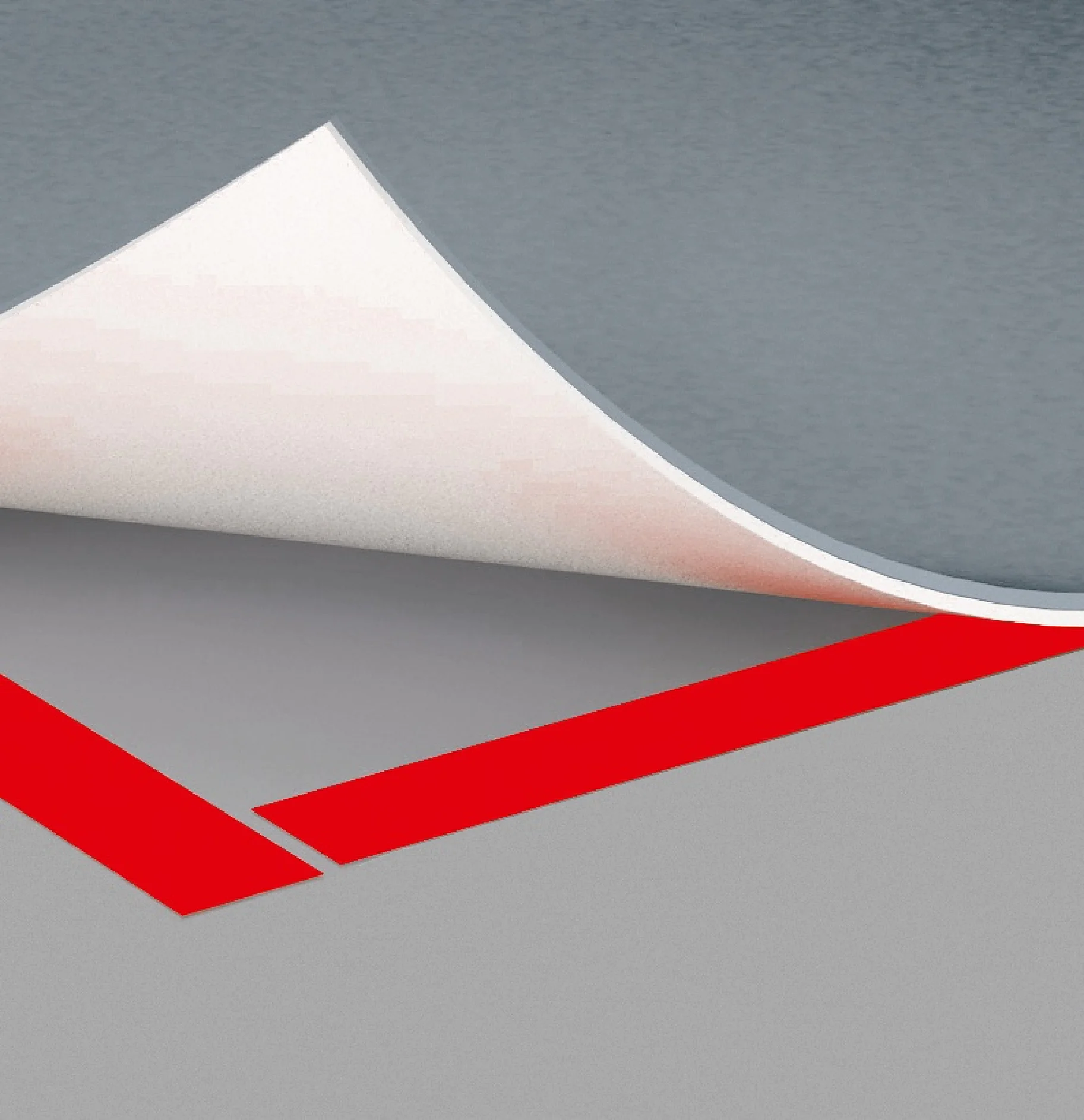 A sheet of paper is partially folded over a gray surface, revealing a red stripe secured with tesa tape beneath it. The scene presents a minimalist composition with contrasting colors and clean lines. (This text has been generated by AI)