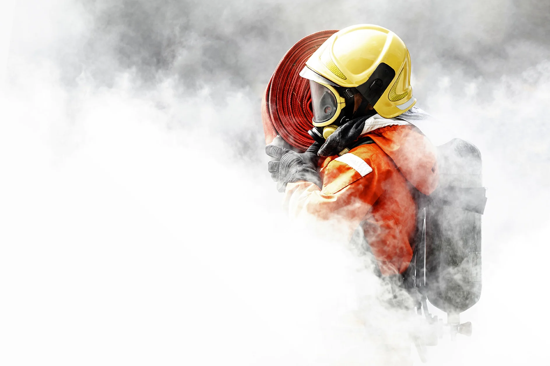 Firefighter in the midst of fire and smoke Helping to prevent the spread of fire
