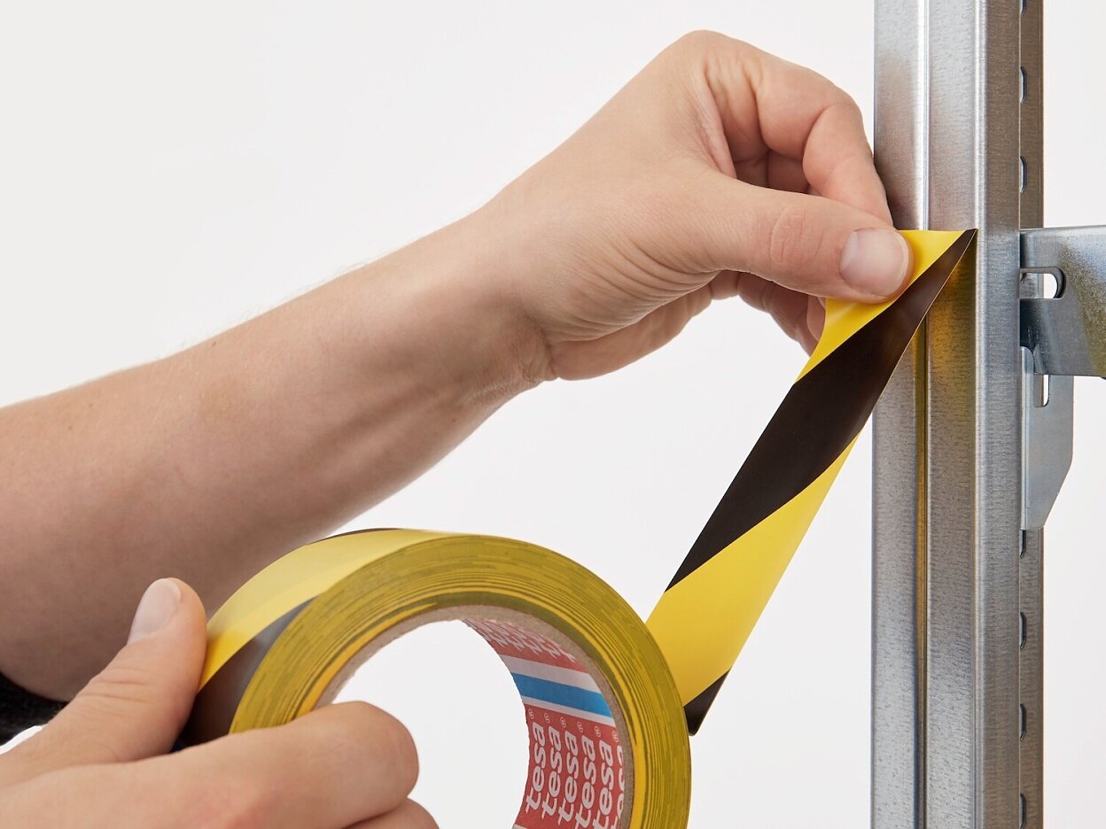 tesa-60760-soft-pvc-floor-marking-hazard-tape-black-yellow-step1of4-ap