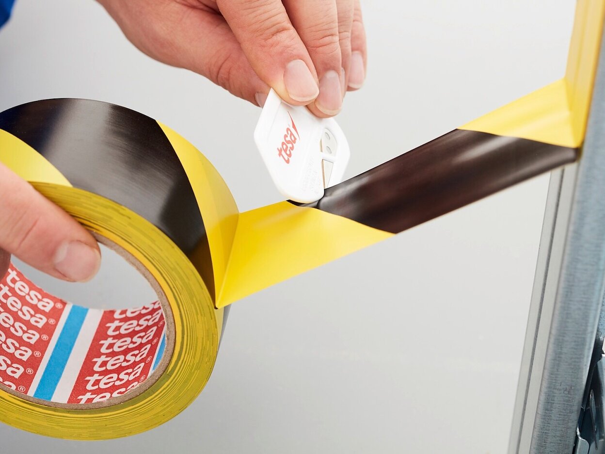 tesa-60760-soft-pvc-floor-marking-hazard-tape-black-yellow-step3of4-ap
