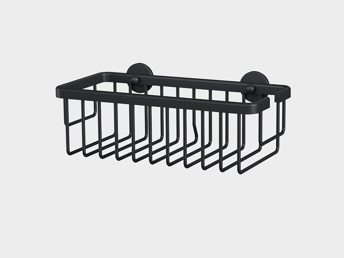 Cestino a parete in metallo nero con due ventose per il fissaggio con nastro adesivo. Il cestino ha una forma rettangolare e un design a griglia aperta, adatto a contenere piccoli oggetti. Lo sfondo è bianco. (This text has been generated by AI)