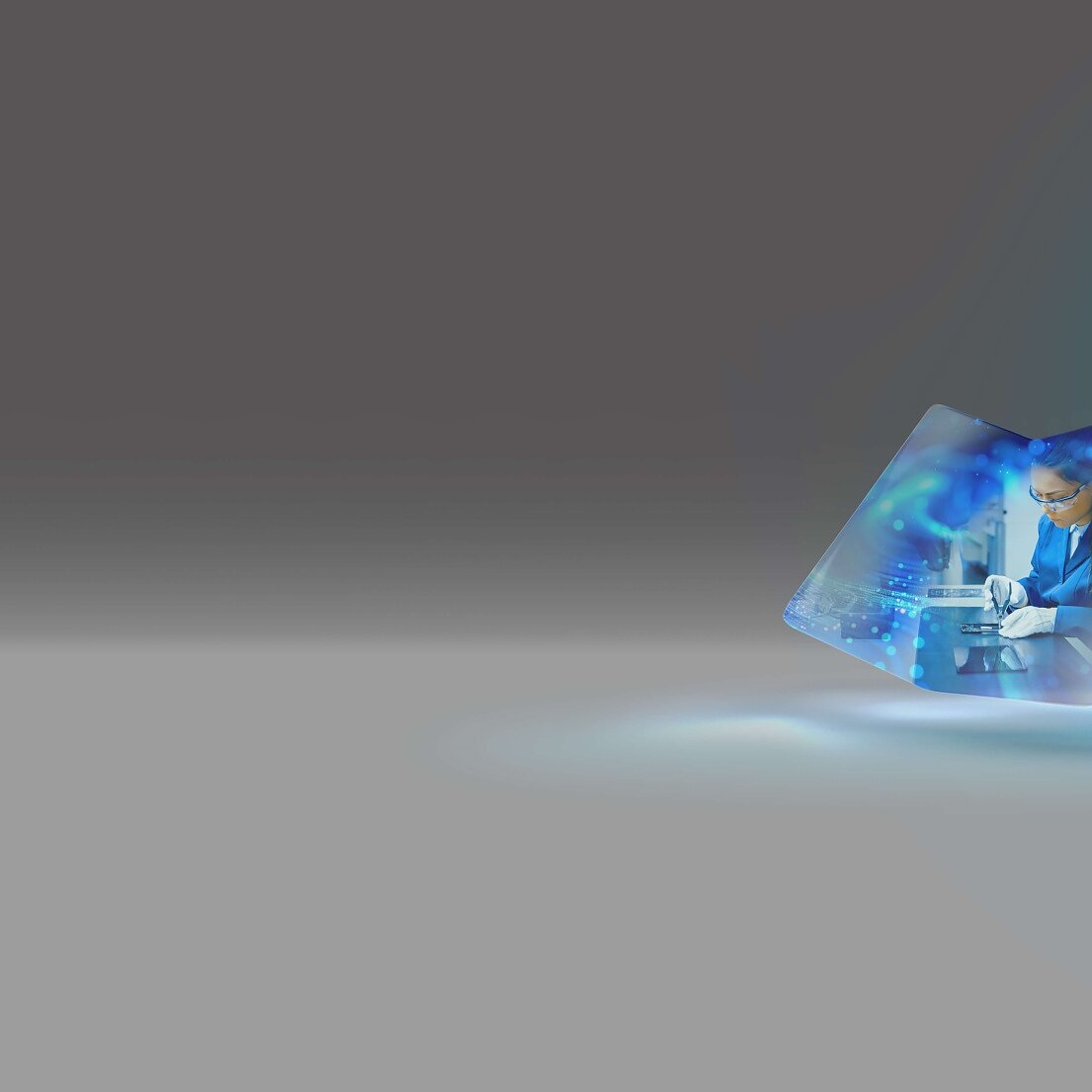 A portal floating in a gray space shows a person in a suit, interacting with digital blue holographic elements. The background is minimalistic, blending from gray to teal at the corner. A glow highlights the portals presence. (This text has been generated by AI)