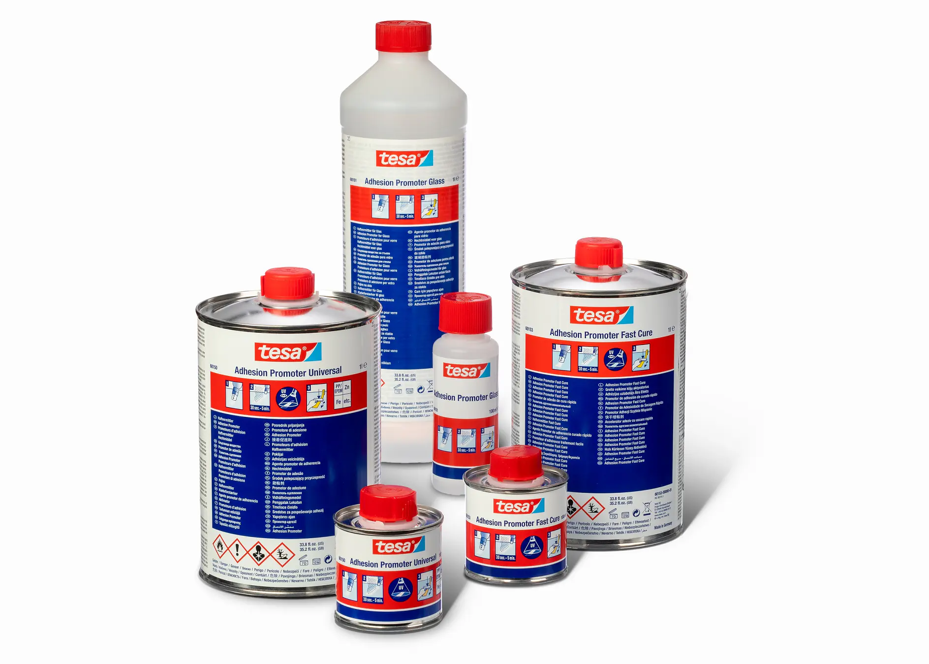 A display of tesa tape adhesive promoter products in various sizes. Containers include bottles and cans with red caps, featuring blue labels with product information and hazard symbols. The background is plain white. (This text has been generated by AI)