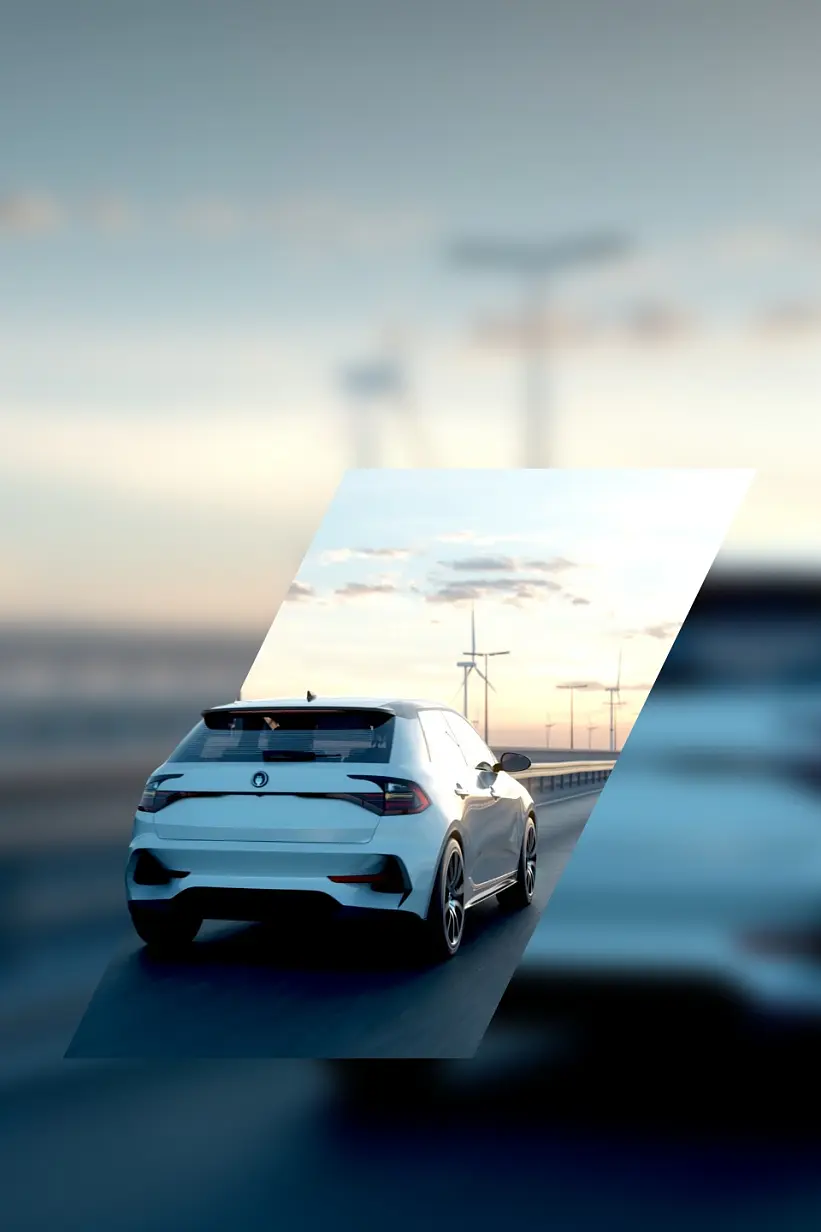 A white car drives on a road with wind turbines visible in the background, under a sky with scattered clouds. The image is edited with the car in focus, surrounded by a blurred background. (This text has been generated by AI)