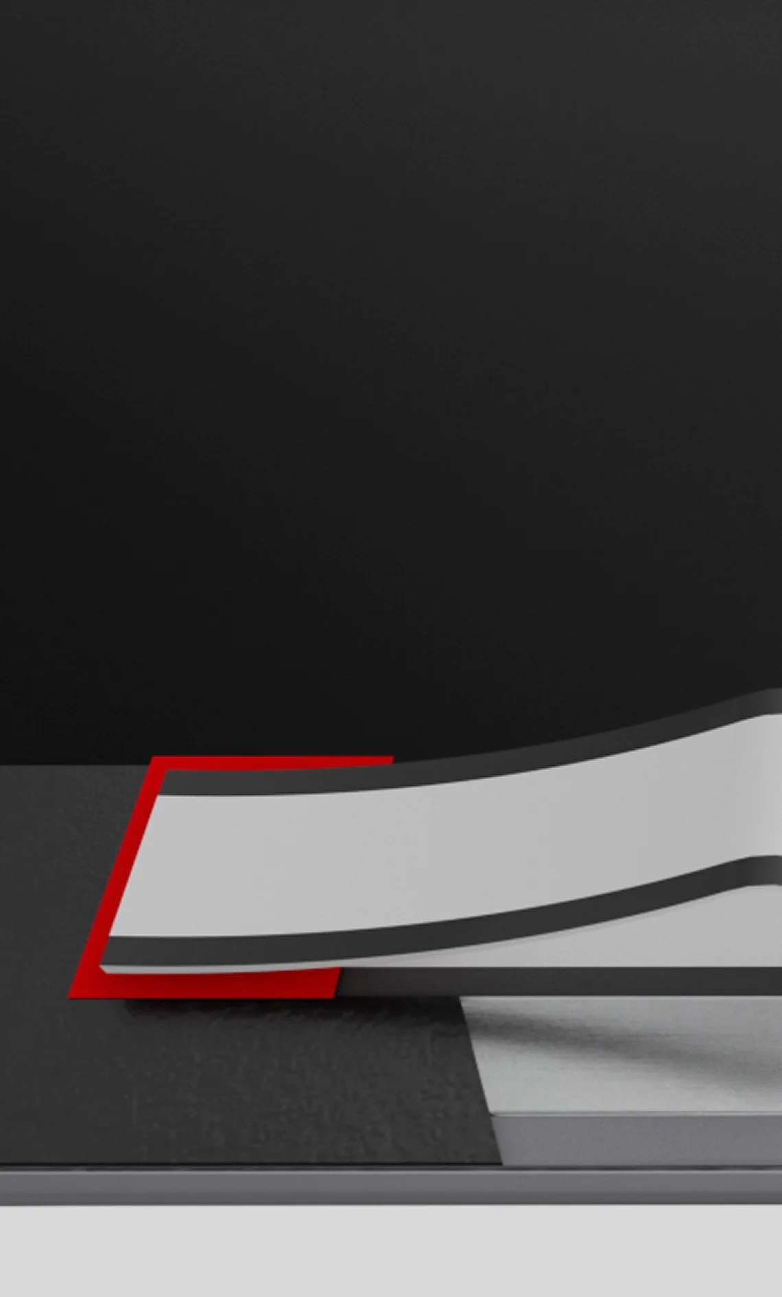 A strip of tesa tape is partially peeled from a dark surface, revealing a red rectangle beneath. The background remains plain and dark. (This text has been generated by AI)