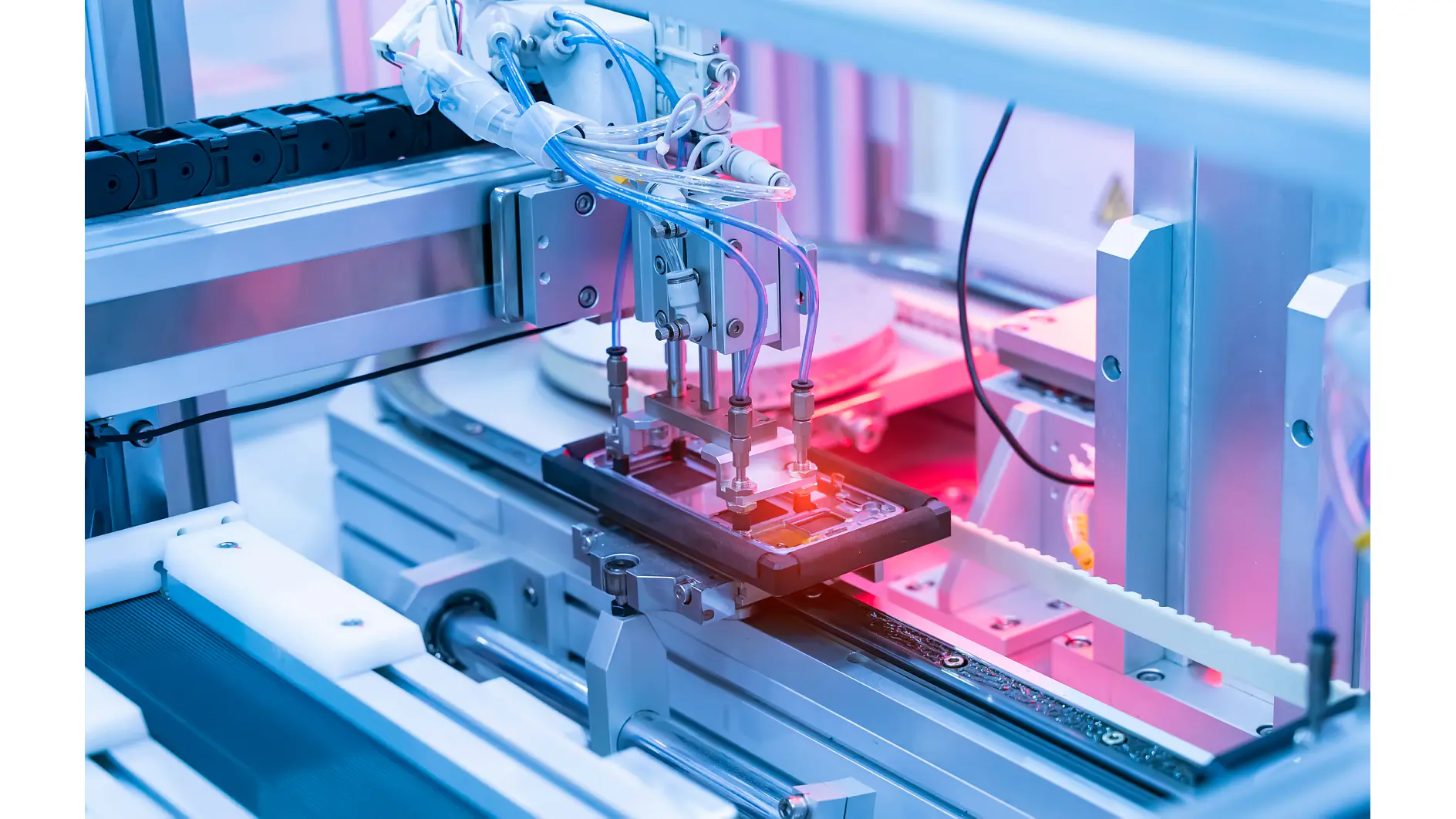 Robot manufacturing a smartphone, bonding individual components with tesa removable tape.