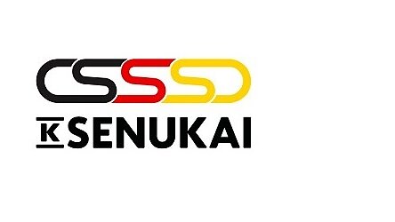Logotips ar burtiem CSSD melnā, sarkanā un dzeltenā krāsā, kam seko K Senukai melnā krāsā uz balta fona. (This text has been generated by AI)