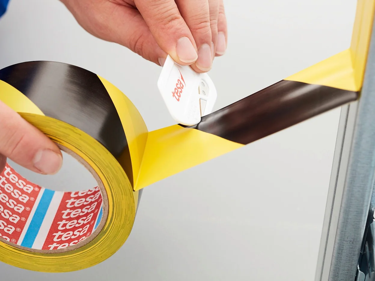 tesa-60760-soft-pvc-floor-marking-hazard-tape-black-yellow-step3of4-ap