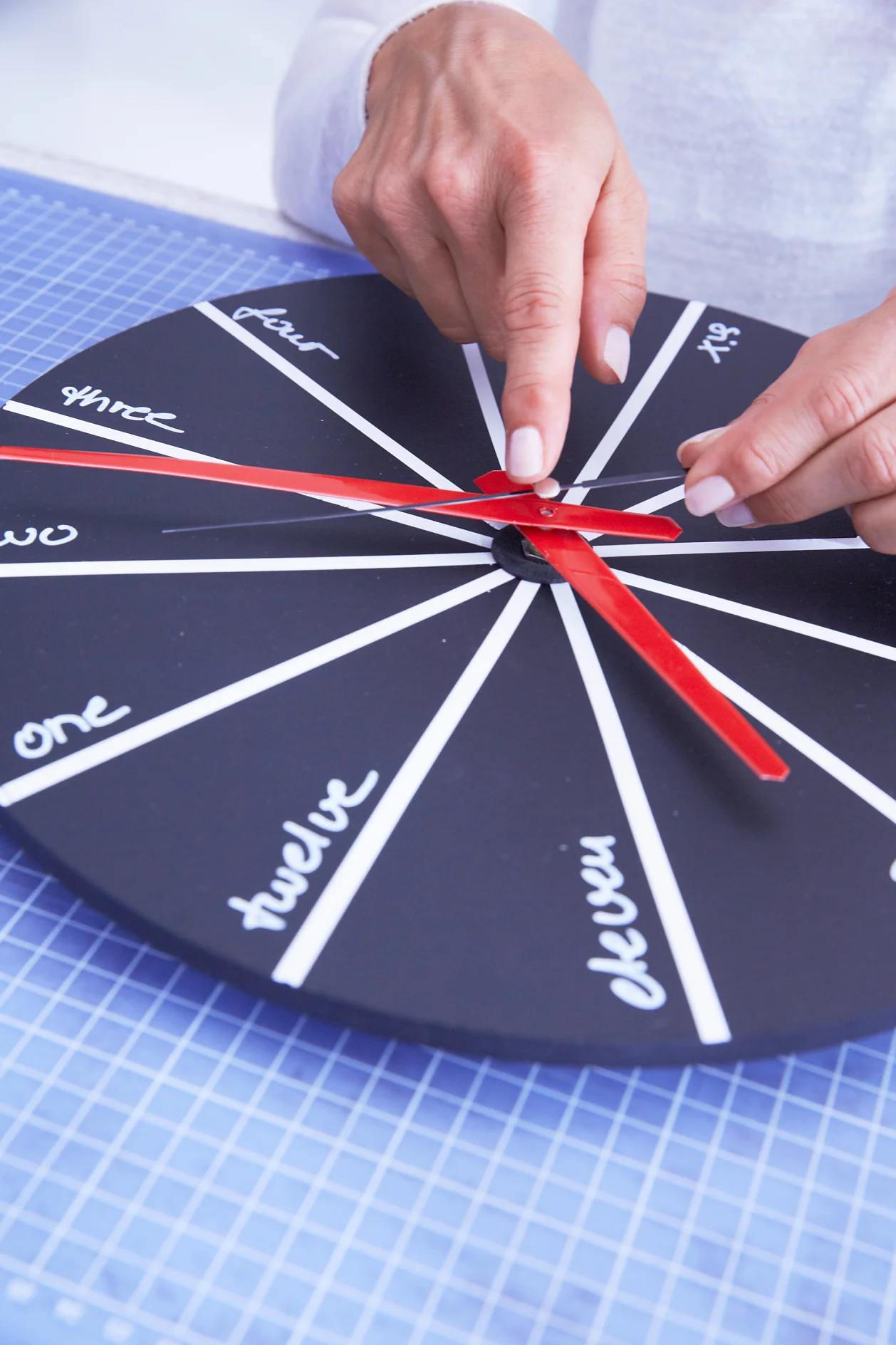Attach pointers. Finally, fix a hook at the back of the clock.