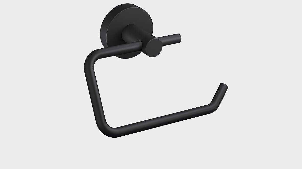 A black matte toilet paper holder mounted on a light gray wall. The holder features a minimalist design with a circular base and a bent arm for holding a roll of tesa tape toilet paper. (This text has been generated by AI)