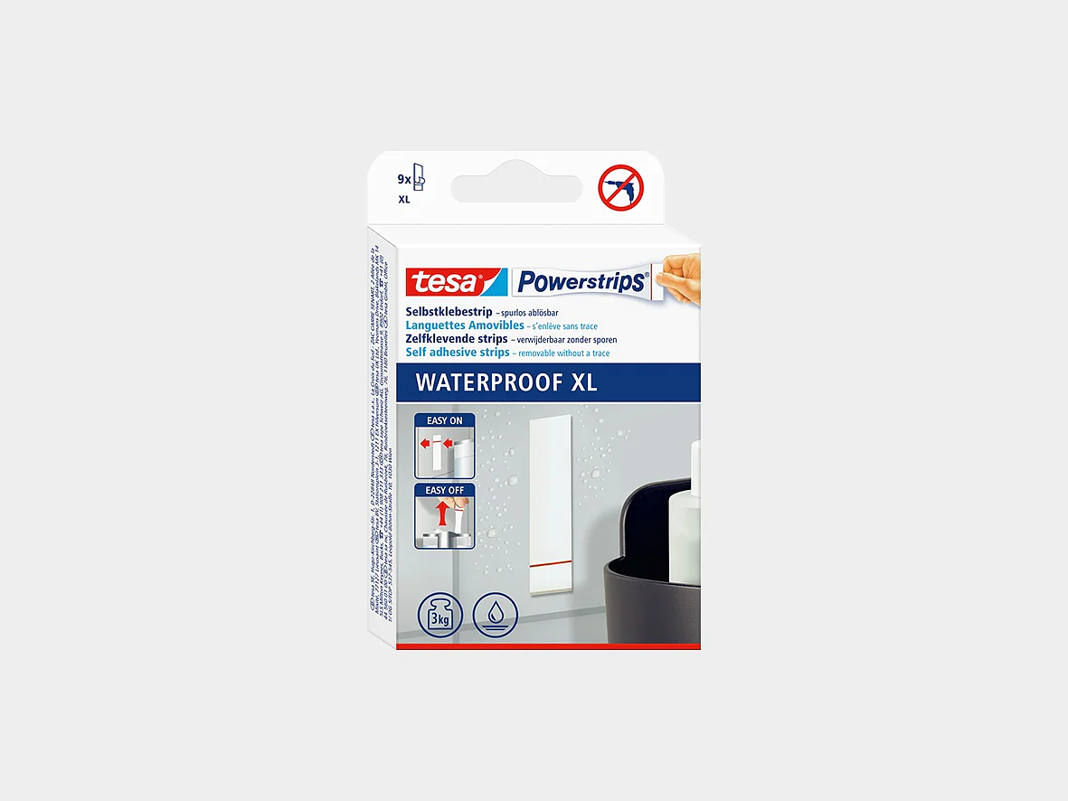 A box of tesa Powerstrips Waterproof XL is shown against a plain background. The packaging is predominantly white and blue, with product usage illustrations and branding visible on the front. (This text has been generated by AI)