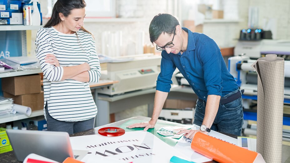 Printing banner in advertising company office Printing banner in advertising company office