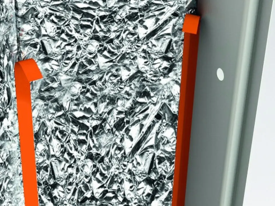 tesa branded orange plastic hooks attached to crinkled reflective insulation material indoors (This text has been generated by AI)