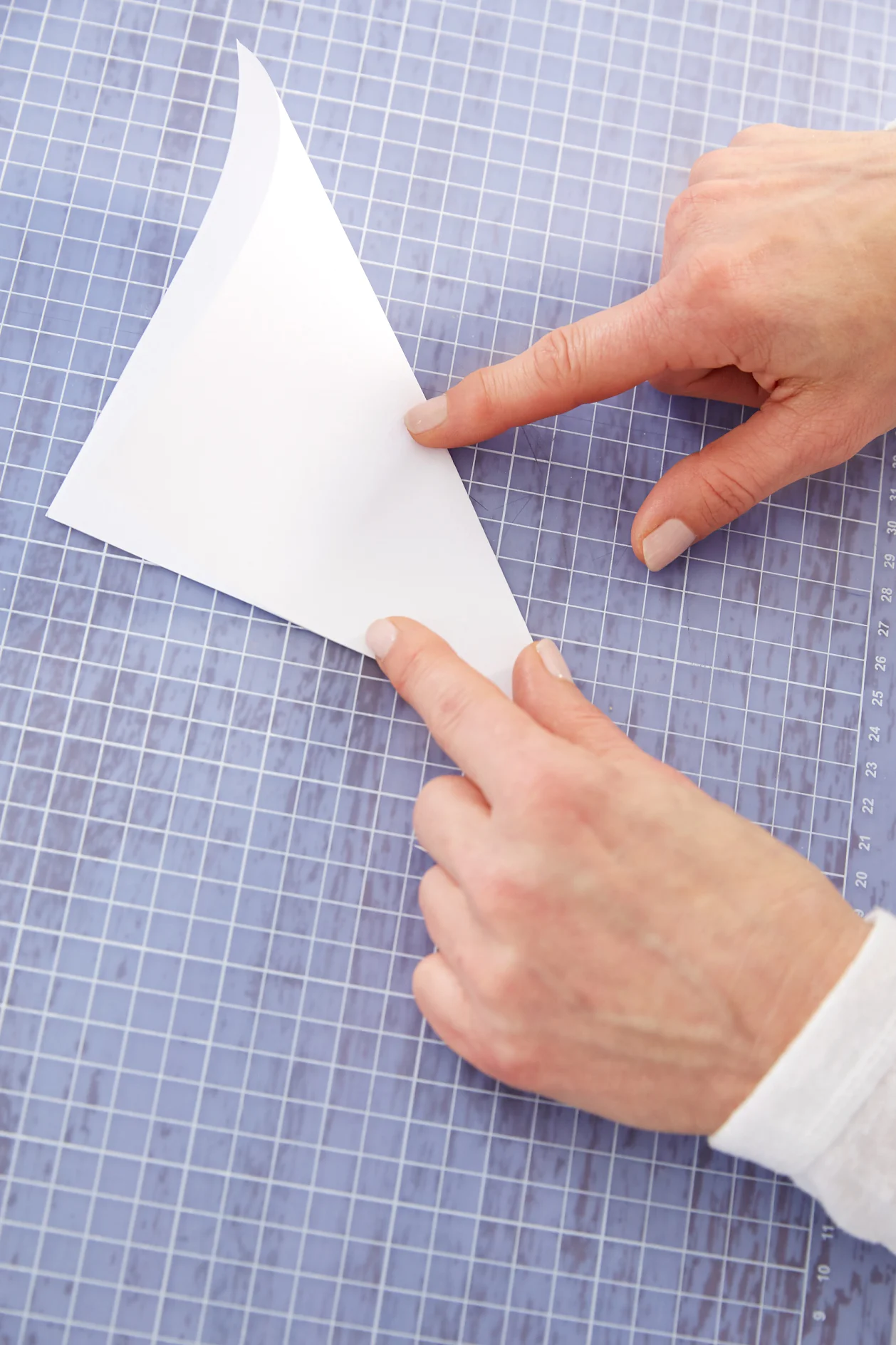 Fold a square piece of paper diagonally