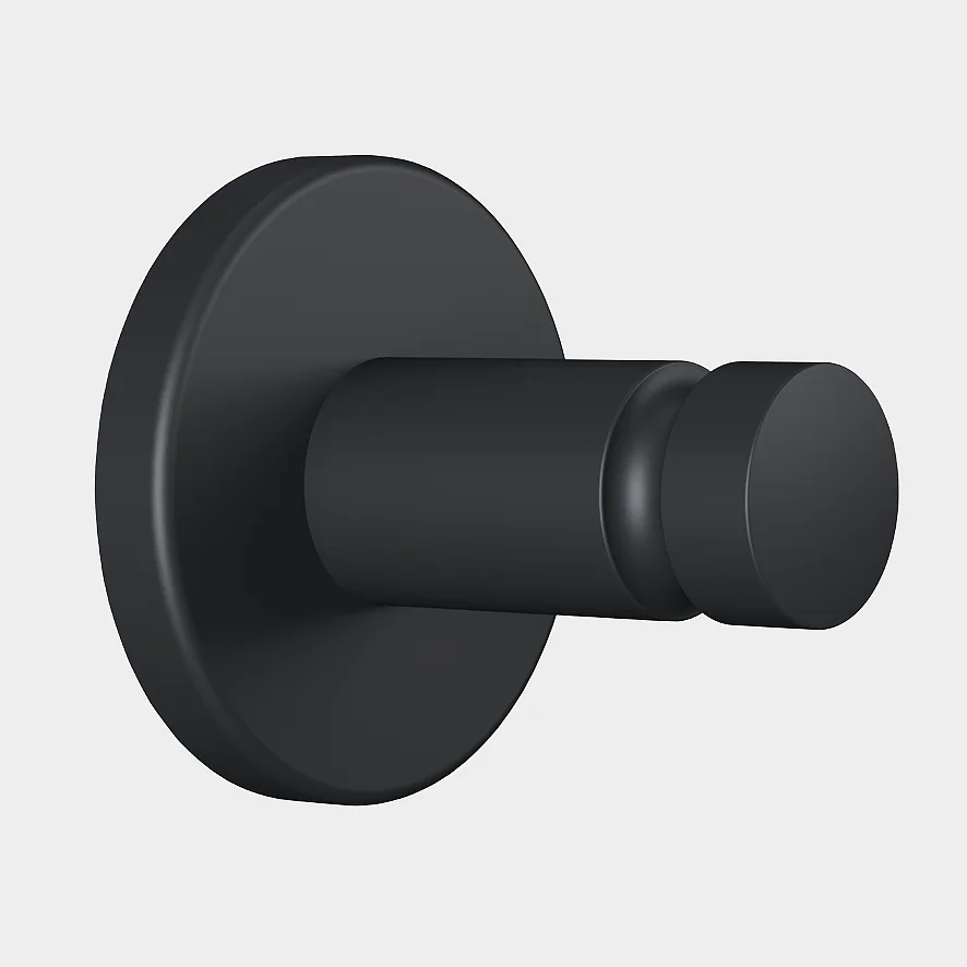 Um gancho de parede preto fosco com uma base redonda e um pino cilíndrico, montado com fita tesa, mostrado contra um fundo cinza claro simples. (This text has been generated by AI)