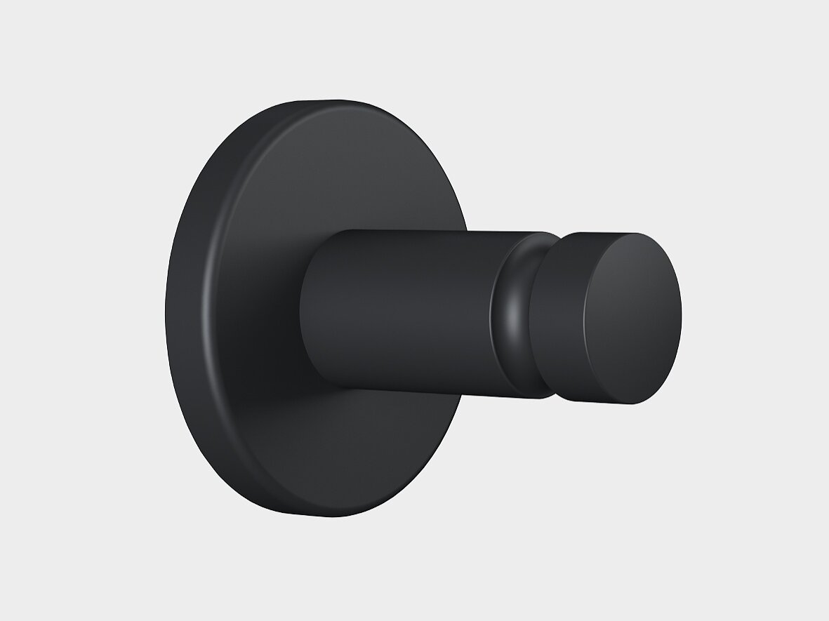 Um gancho de parede preto fosco com uma base redonda e um pino cilíndrico, montado com fita tesa, mostrado contra um fundo cinza claro simples. (This text has been generated by AI)