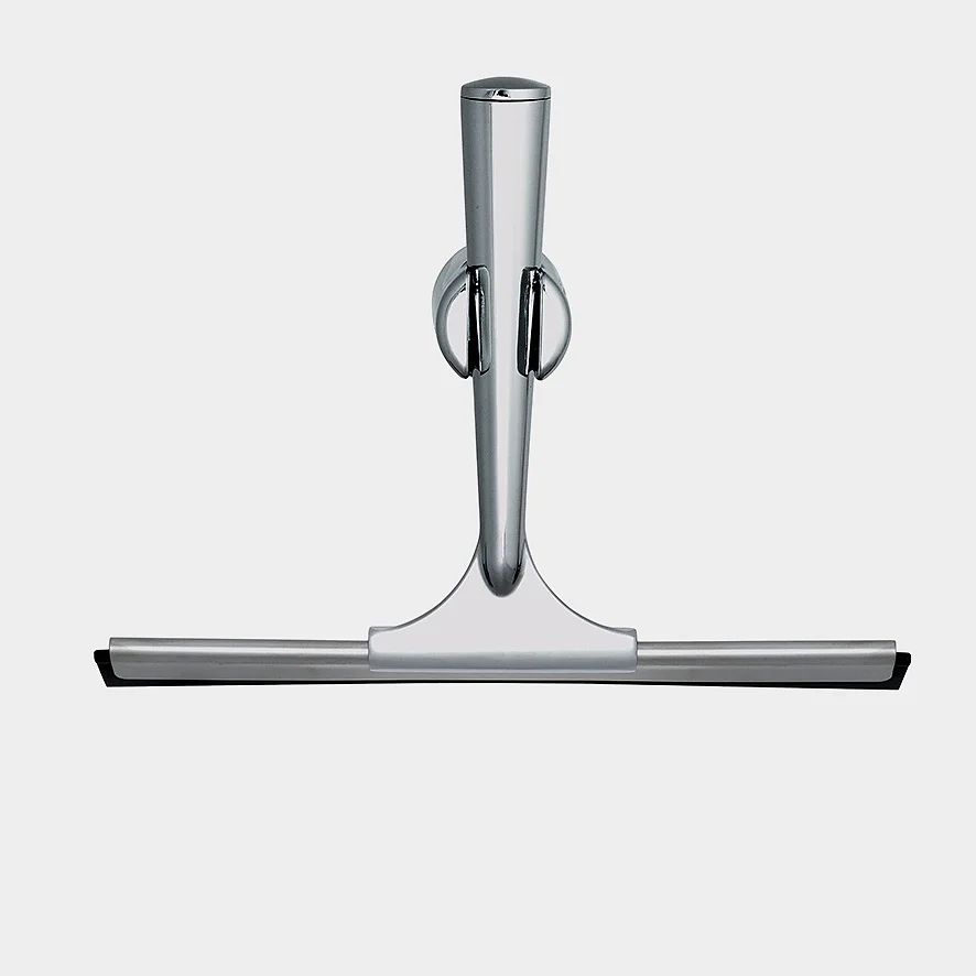 A metallic shower squeegee with a sleek, modern design. It has a stainless steel handle and a flat rubber blade for wiping surfaces. The handle features a hanging ring for easy storage. The background is plain and light gray, with tesa tape prominently used to secure the squeegee in place for optimal convenience. (This text has been generated by AI)