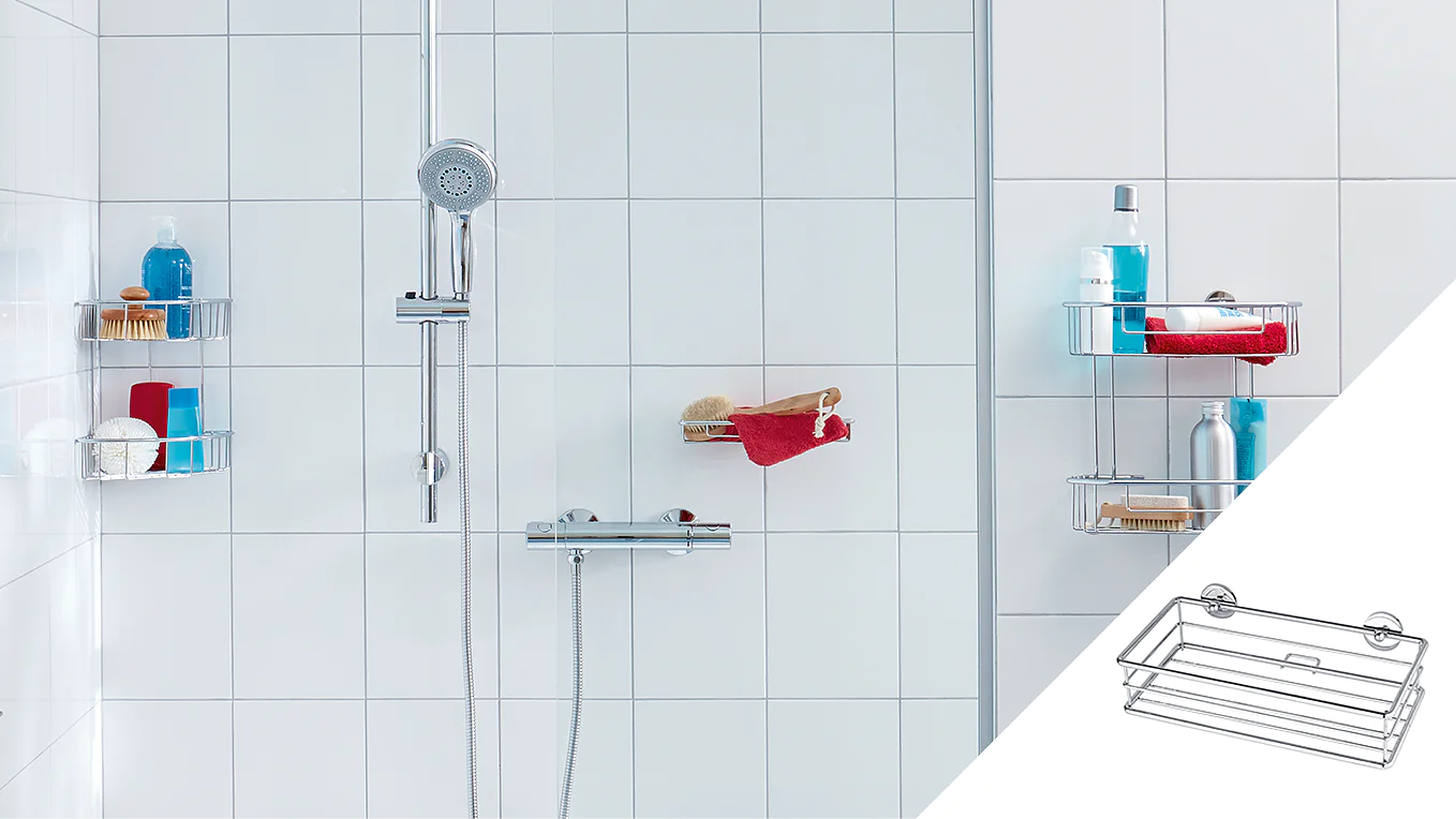 A white tiled shower with a chrome showerhead and controller. Three corner shelves hold toiletries including bottles and brushes. A red towel is draped over one shelf. An inset shows a wire rack attached with tesa tape suction cups. (This text has been generated by AI)