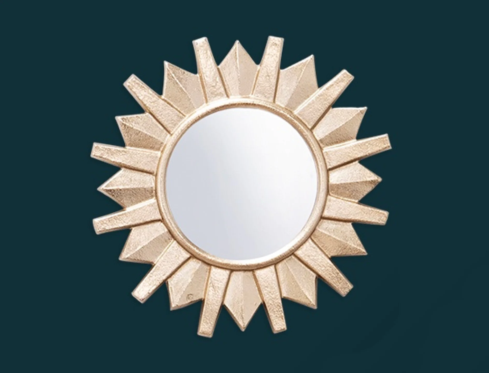 En rund spegel med sunburst-design och en guldram är inställd mot en mörk krickfärgad bakgrund. (This text has been generated by AI)