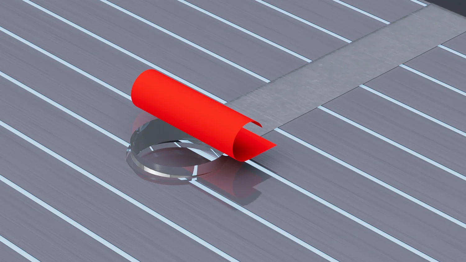 A red, curved object is partially rolled onto a horizontal, gray-striped surface with a narrow strip of tesa tape intersecting the stripes. The background is a light blue area at the top edge of the image. (This text has been generated by AI)