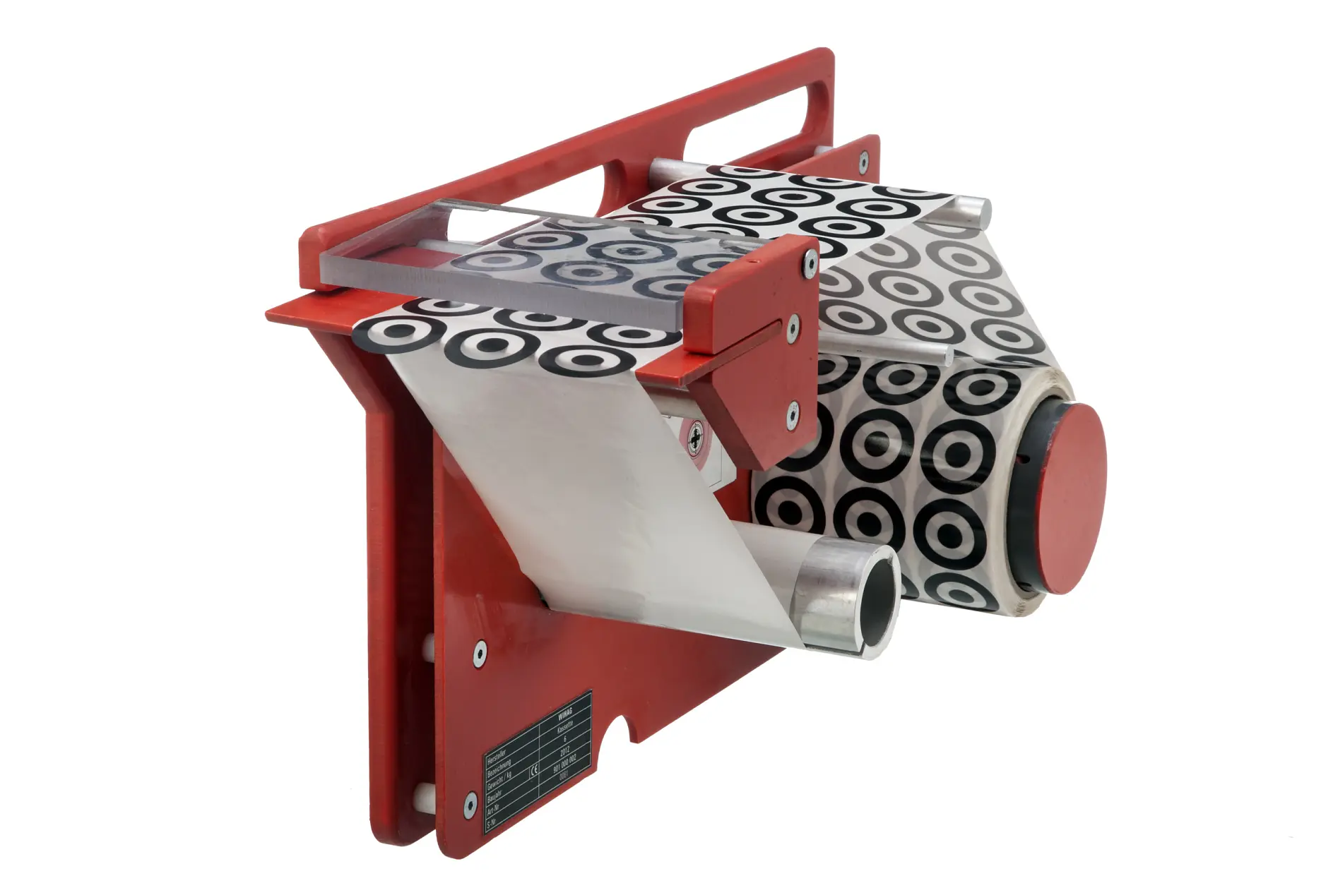 A red, industrial-looking machine with stainless steel components and black-and-white circular patterned tesa tape. It has a handle, a roll of tesa tape partially unspooled, and a red circular knob on the side.