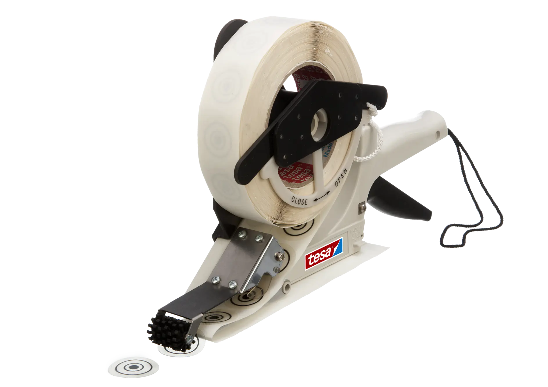 A handheld labeling tool featuring a roll of circular labels is described. The device has a white handle with a black trigger and a metal component for dispensing the labels. A black wheel is attached to guide the labels. The brand name tesa tape is visible.