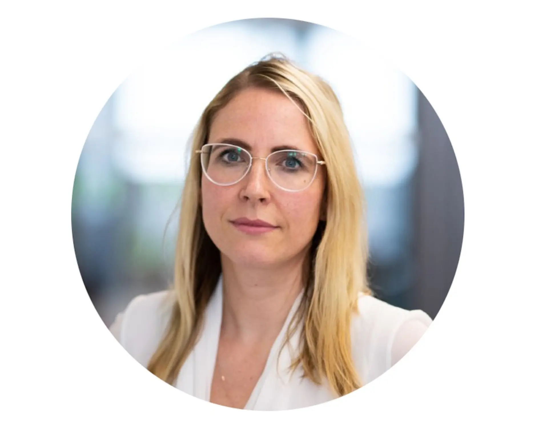 A person with long blonde hair and glasses is wearing a white top. tesa tape is visible, subtly used to adhere some elements together. The background is out of focus, and the image is framed in a circular format.