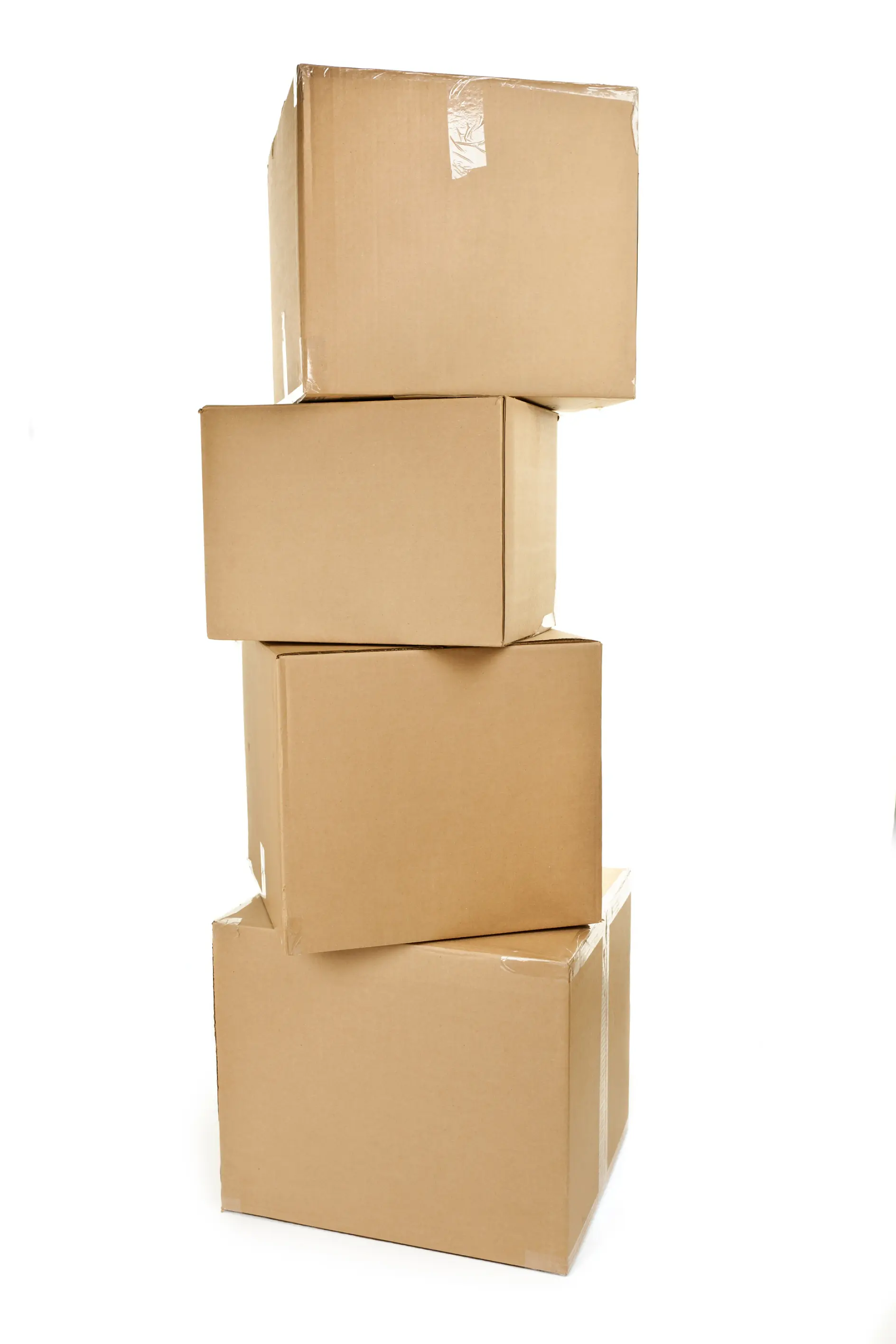 Four stacked cardboard boxes in various sizes against a white background. tesa tape can be seen sealing the boxes, ensuring they stay securely closed.