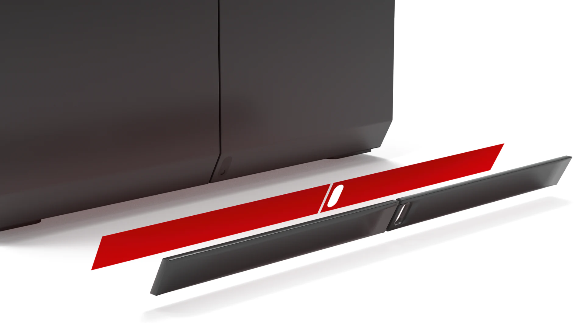 A red panel is partially detached from a gray, metallic surface. There are grooves and slots visible on the panel and the surface, indicating attachment points or connectors. The background is plain and unobtrusive. (This text has been generated by AI)