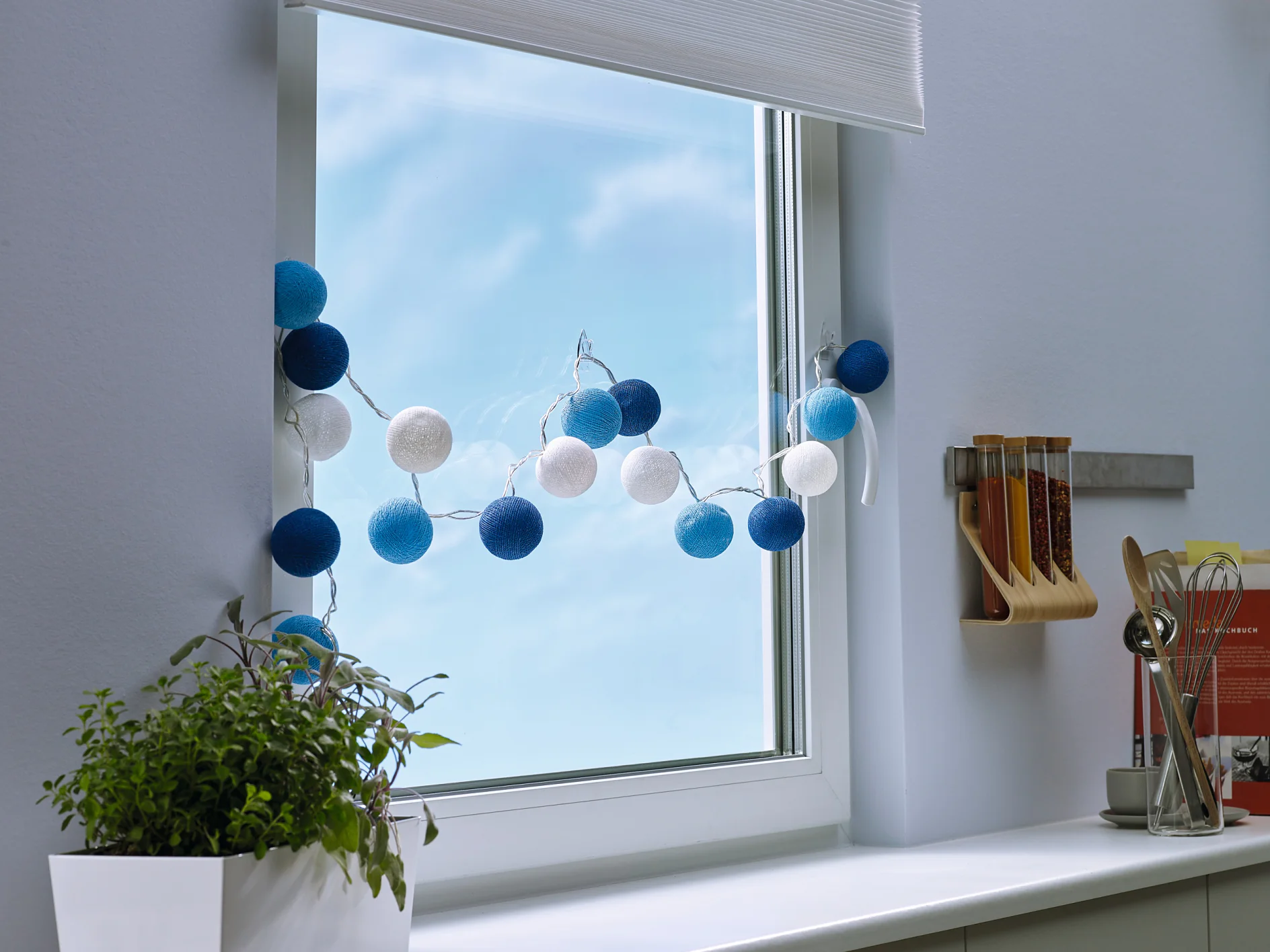 Transparent and nearly invisible adhesive hooks for mounting decorative objects on windows or mirrors.