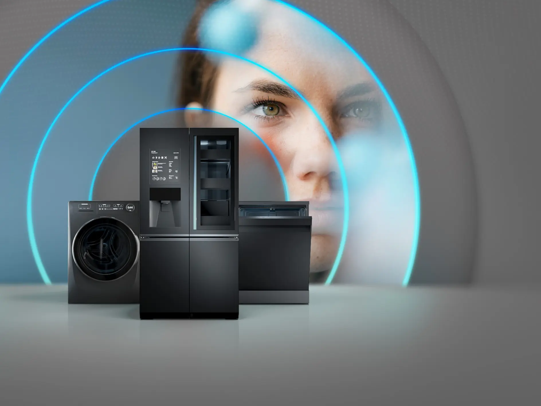 A washing machine, refrigerator, and dishwasher are displayed in the foreground. In the background, a womans face is partially visible, with blue concentric circles emanating from the appliances, suggesting connectivity or technology. (This text has been generated by AI)