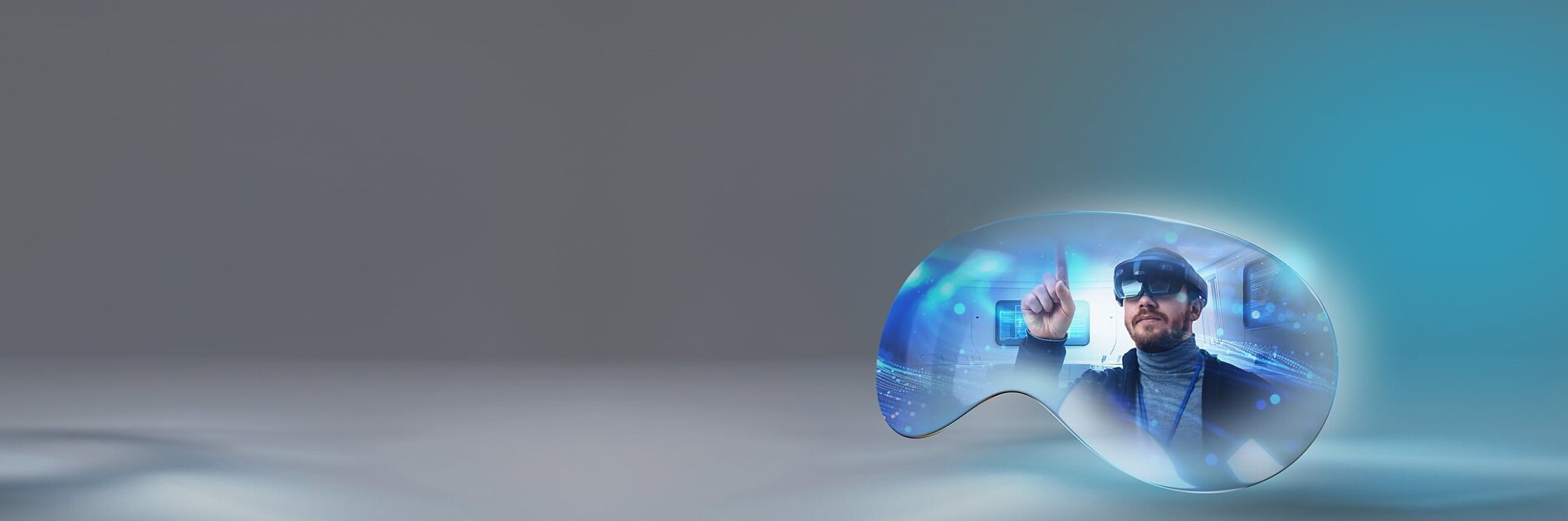 A man wearing virtual reality goggles interacts with a digital holographic interface. The scene is encapsulated within a light blue, abstract curved shape on a gray background. The man appears focused, with one hand pointing forward and holding tesa tape.