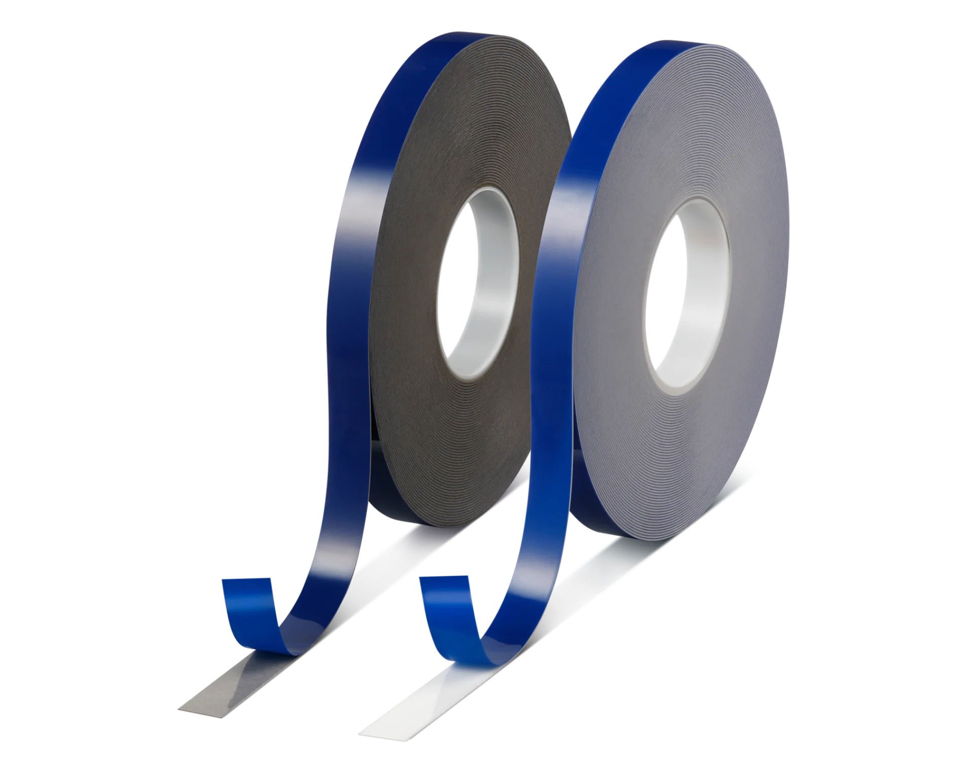 Two rolls of adhesive tesa tape are displayed side by side against a solid background. The tesa tape on the left is black, while the tesa tape on the right is white. Both have a blue release liner partially unwound, revealing the adhesive surface. (This text has been generated by AI)